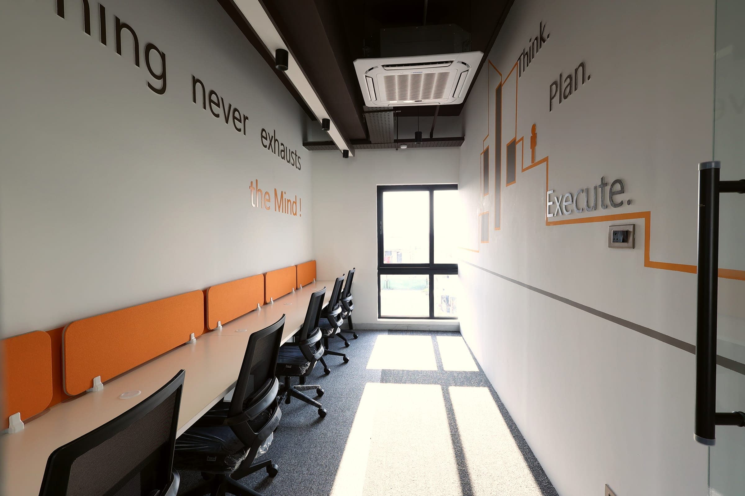 Learning Never Exhausts the Mind wall and Think Plan Execute graphic in the 5 seater private office at Fliqzo Coimbatore