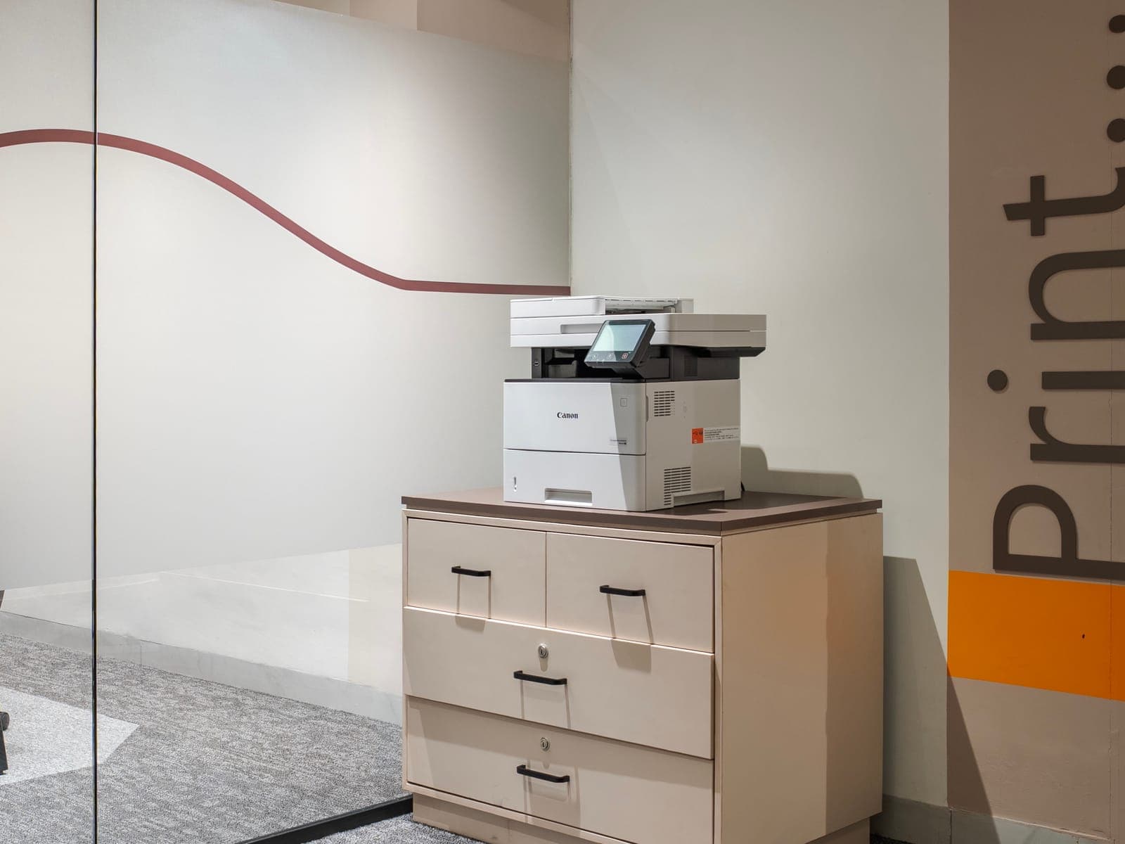 Canon multifunction printer at the Print station beside the glass cabins at Fliqzo Coimbatore